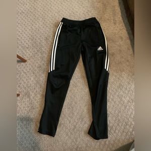 Black adidas joggers with white stripes